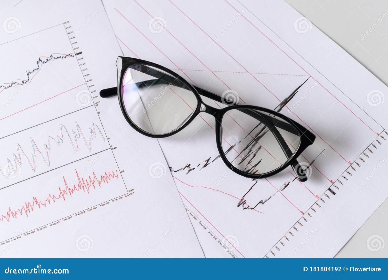 ÃÂ¡loseup of part of graphs and charts printed on the paper. selective focus.